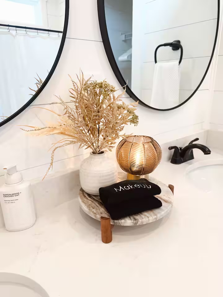 Tiny Timber bathroom vanity styling detail with lamp and florals