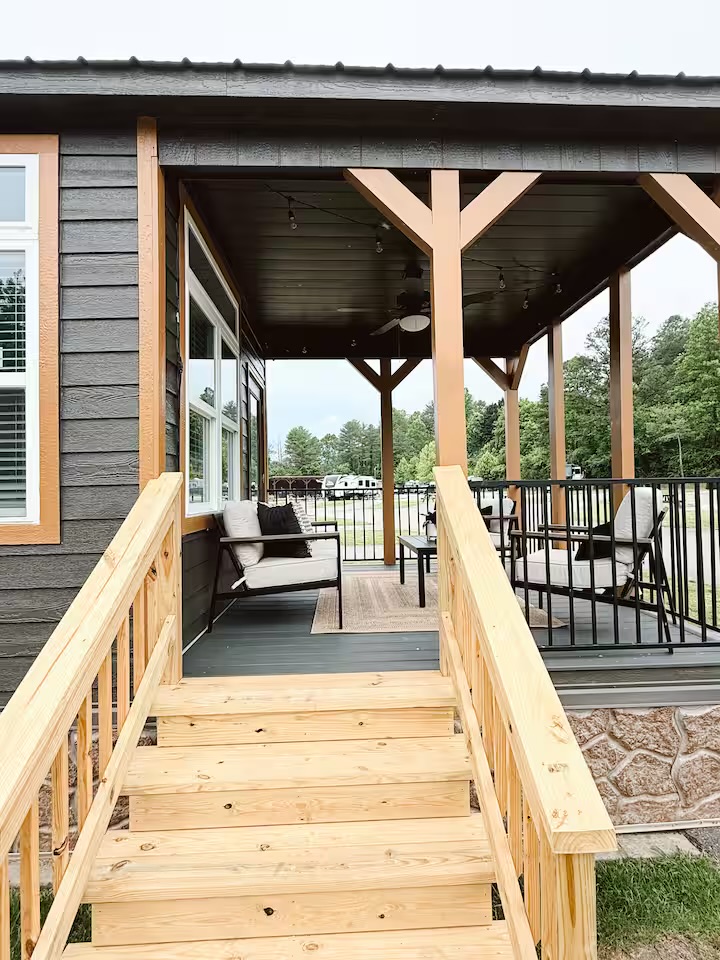 Tiny Timber covered front porch with seating and steps