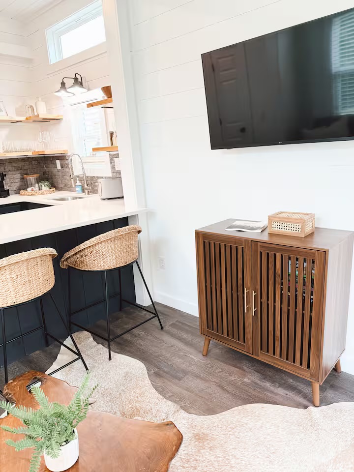 Tiny Timber kitchen bar with woven stools and media console