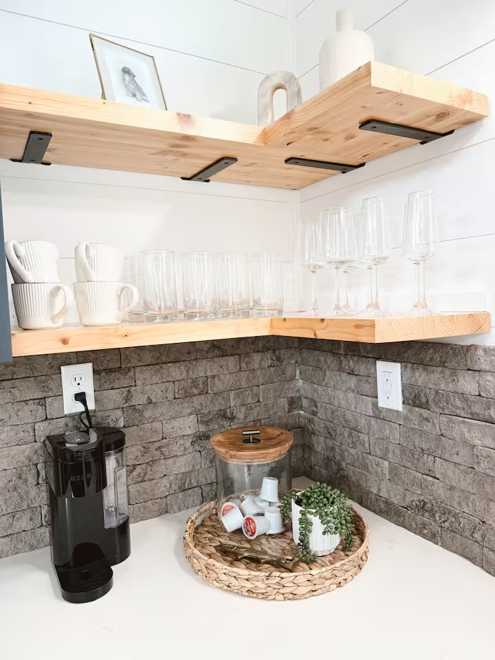 Tiny Timber coffee bar corner with glassware, mugs, and Keurig