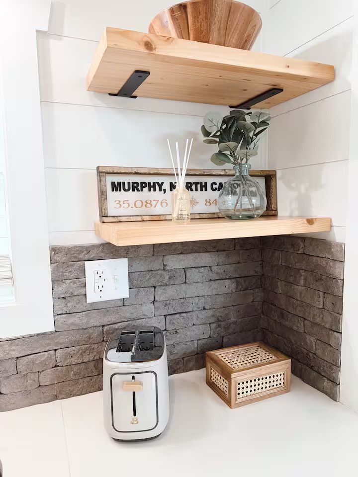 Tiny Timber shelf detail with Murphy, North Carolina coordinates sign and toaster